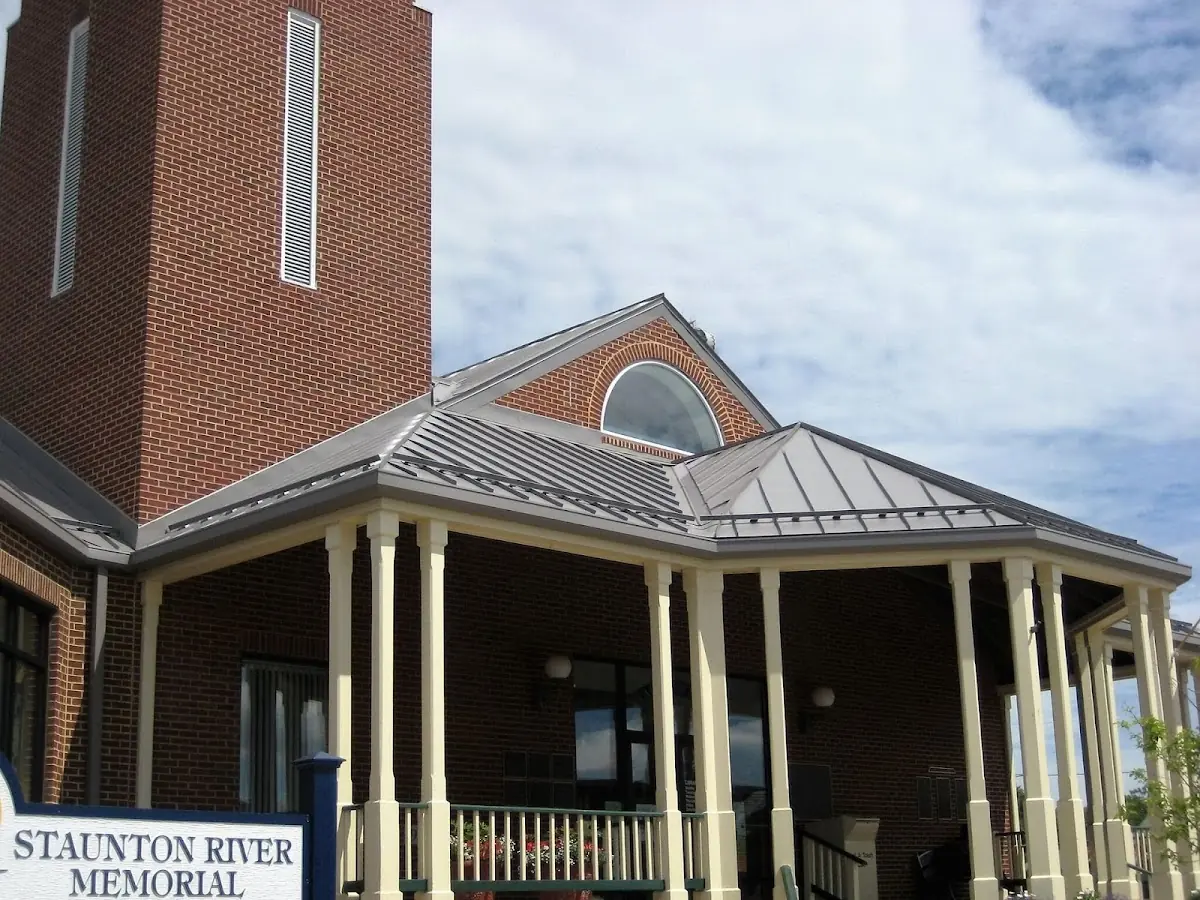 Skilled roofing craftsmen working on a residential roof in Portsmouth